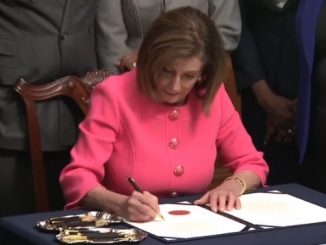 Nancy Pelosi signing articles of impeachment