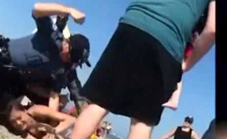 NJ beach officer punching female