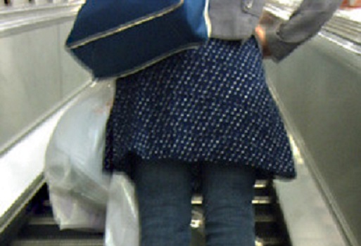 woman on escalator