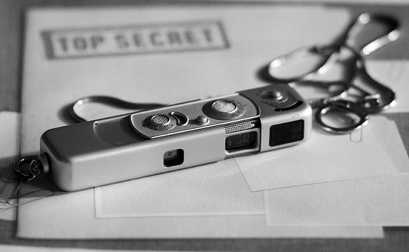 spy camera on top secret folder