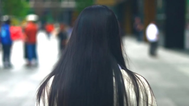 Long haired woman rear view