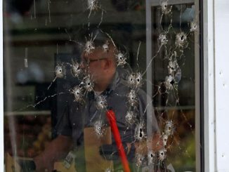 Arkansas mass shooting window damage