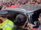 Liverpool parade car surrounded