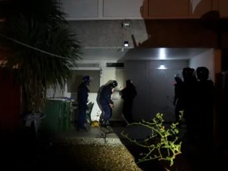 police raid a home in London connected with romance fraud