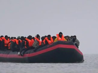 migrants onboard small boat in Gravelines France