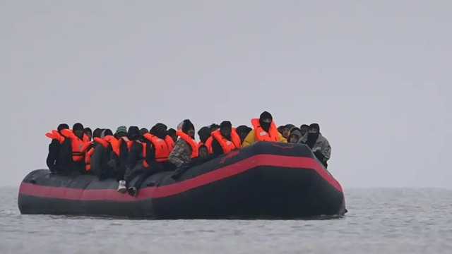 migrants onboard small boat in Gravelines France