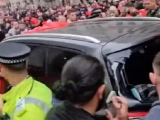 Liverpool parade car surrounded